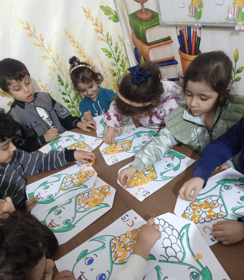 نشاط فني: تلوين حبّات الذرة مع حرف الذال